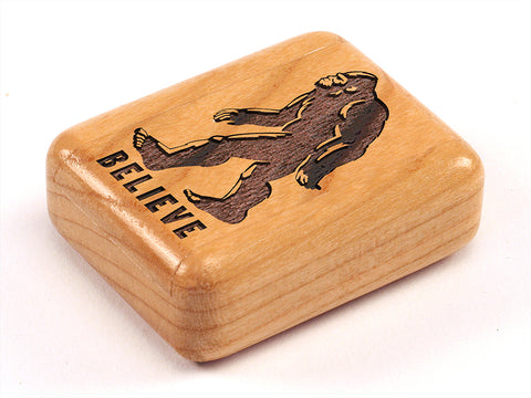 Top View of a 2" Flat Narrow Cherry with laser engraved image of Bigfoot/Believe
