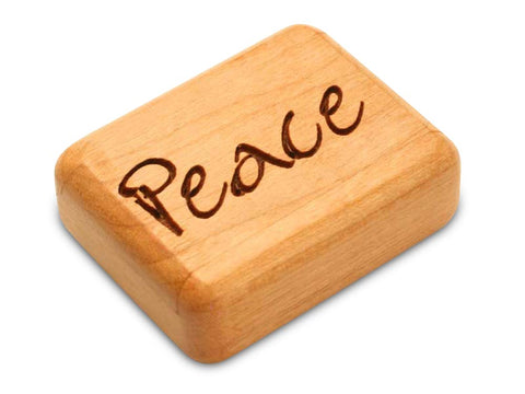 Top View of a 2" Flat Narrow Cherry with laser engraved image of Peace