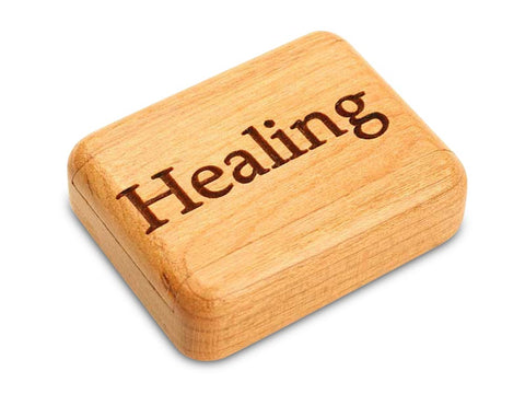 Top View of a 2" Flat Narrow Cherry with laser engraved image of Healing