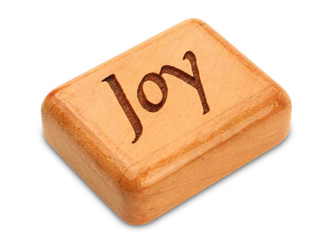 Top View of a 2" Flat Narrow Cherry with laser engraved image of Joy