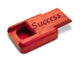 Top View of a 2" Flat Narrow Padauk with laser engraved image of Success