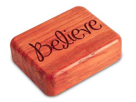 Top View of a 2" Flat Narrow Padauk with laser engraved image of Believe