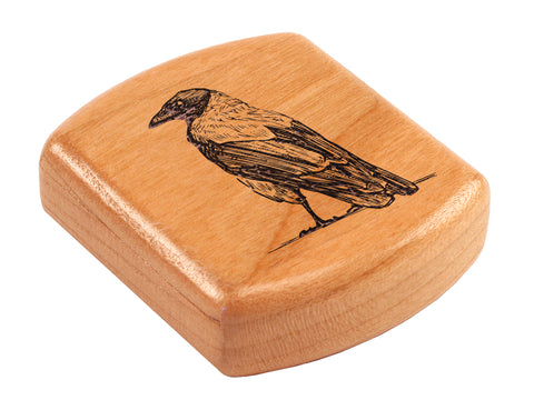 Top View of a 2" Flat Wide Cherry with laser engraved image of Crow