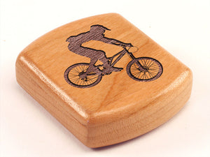 Top View of a 2" Flat Wide Cherry with laser engraved image of Mountain Biker