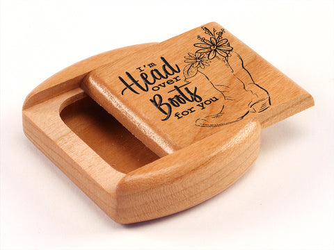 Top View of a 2" Flat Wide Cherry with laser engraved image of Head Over Boots