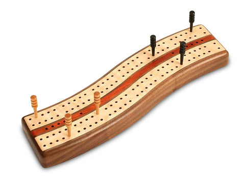 Top View with Pegs of a Walnut S Curve Cribbage Board