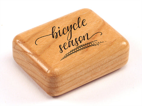Top View of a 2" Flat Narrow Cherry with laser engraved image of Bicycle Season