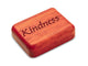 Opened View of a 2" Flat Narrow Padauk with laser engraved image of Kindness