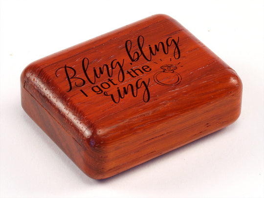 Top View of a 2" Flat Narrow Padauk with laser engraved image of Bling Bling I Got the Ring