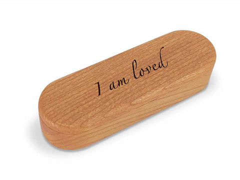 Top View of a Snap-Lid Mantra with laser engraved image of I am loved