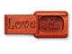 Top View of a 2" Flat Narrow Padauk with laser engraved image of Love, Live, Laugh and Be Happy