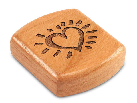 Top View of a 2" Flat Wide Cherry with laser engraved image of Heart Glow