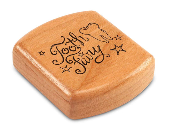 Top View of a 2" Flat Wide Cherry with laser engraved image of Tooth Fairy