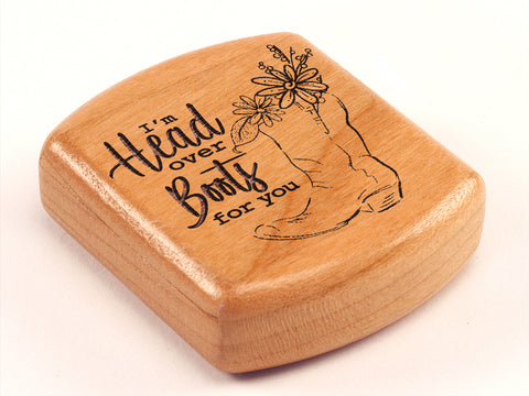 Top View of a 2" Flat Wide Cherry with laser engraved image of Head Over Boots