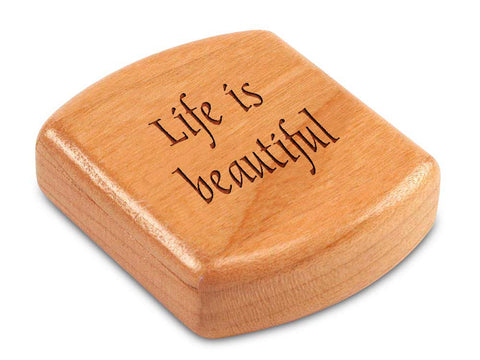 Top View of a 2" Flat Wide Cherry with laser engraved image of Quote -Life is beautiful.