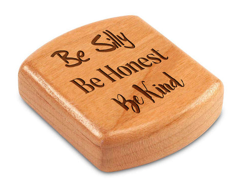 Top View of a 2" Flat Wide Cherry with laser engraved image of Quote -Be Silly, Be Honest, Be Kind